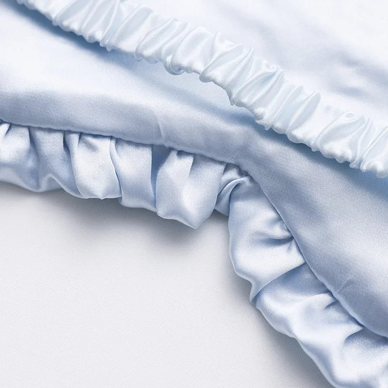 Masque de sommeil en soie à volants élégants